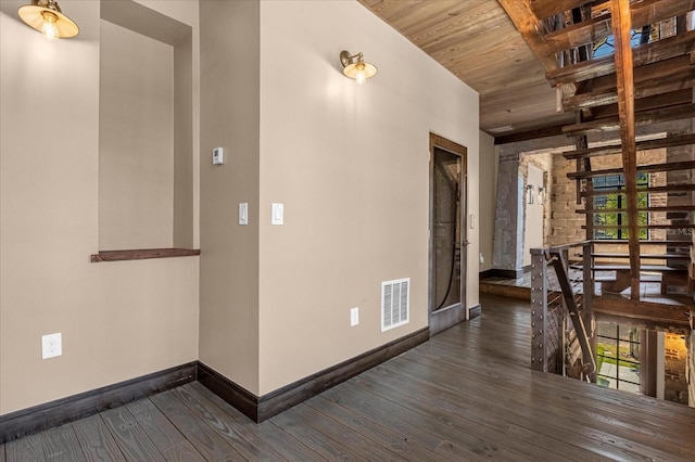 hall with wooden ceiling, plenty of natural light, and dark wood-type flooring