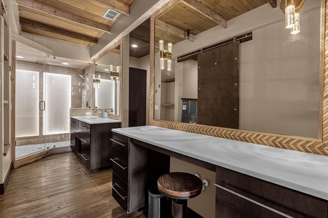 bathroom featuring hardwood / wood-style floors, wooden ceiling, beam ceiling, and vanity