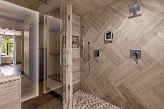 bathroom with a shower with door