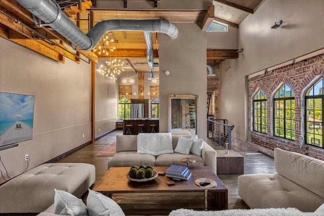 living room with high vaulted ceiling, a notable chandelier, wood-type flooring, and beam ceiling