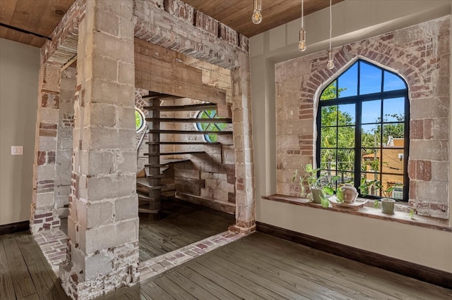 interior space with dark hardwood / wood-style flooring and wooden ceiling