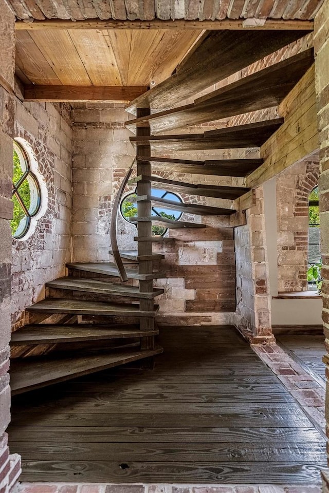 interior space with plenty of natural light, wooden ceiling, and hardwood / wood-style floors