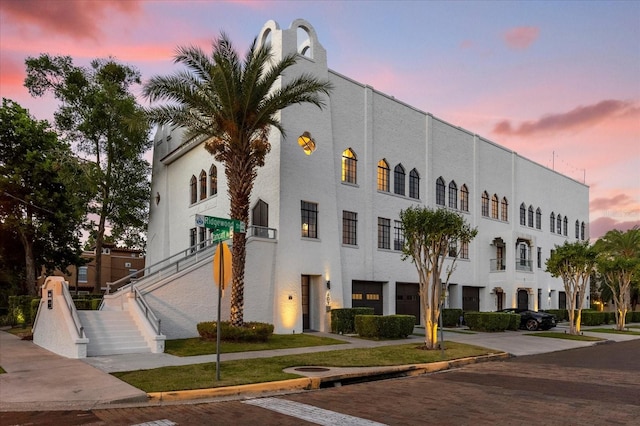 view of outdoor building at dusk