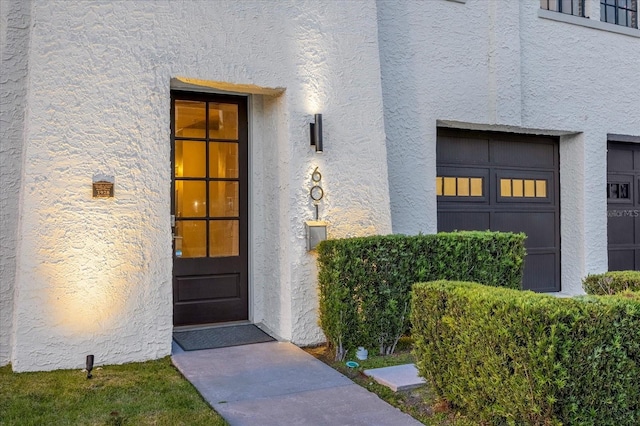 doorway to property featuring a garage