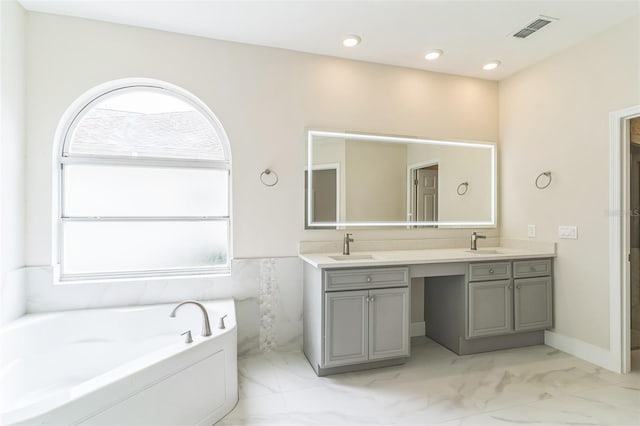 bathroom with vanity, visible vents, recessed lighting, a garden tub, and marble finish floor
