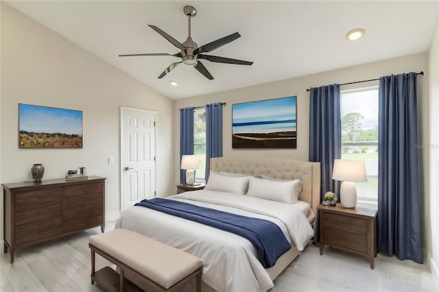 bedroom with recessed lighting, light wood-type flooring, a ceiling fan, and vaulted ceiling