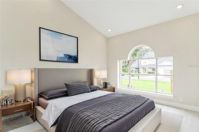 bedroom with lofted ceiling, recessed lighting, and baseboards