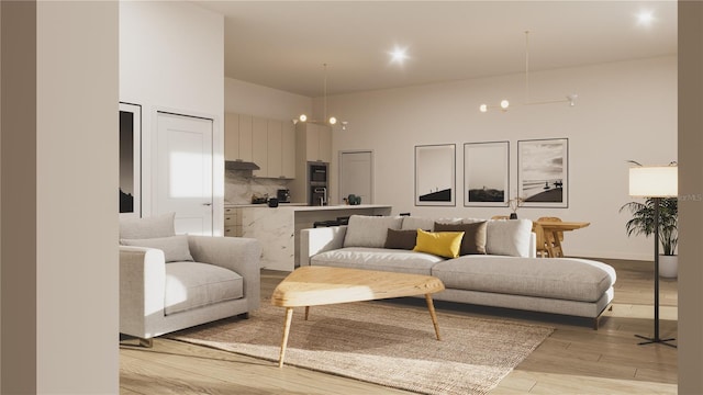 living room featuring light hardwood / wood-style flooring and a notable chandelier