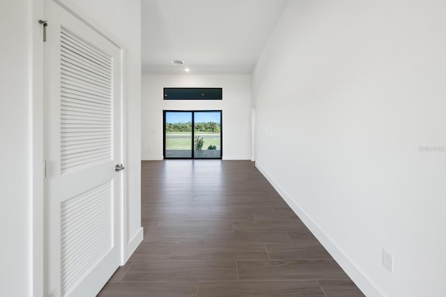 corridor with dark wood-type flooring