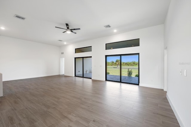 spare room featuring dark hardwood / wood-style floors and ceiling fan