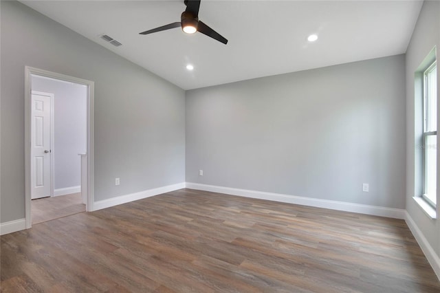 unfurnished room with ceiling fan, plenty of natural light, and hardwood / wood-style flooring