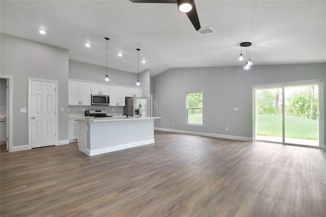 kitchen with white cabinetry, pendant lighting, an island with sink, and stainless steel appliances