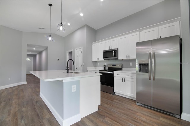 kitchen featuring a kitchen island with sink, dark wood-type flooring, white cabinets, and stainless steel appliances