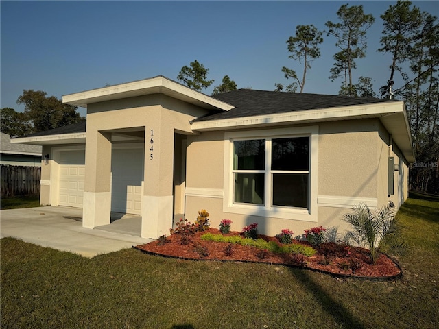 view of front of home with a garage and a front yard