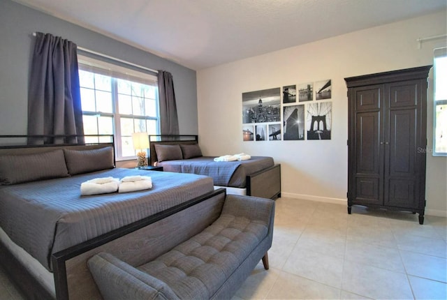 bedroom with light tile floors