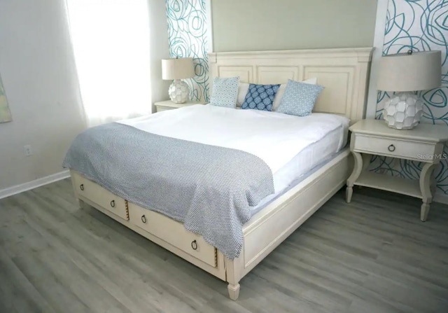 bedroom featuring wood-type flooring