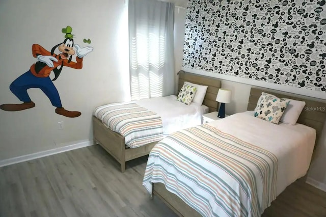 bedroom featuring wood-type flooring