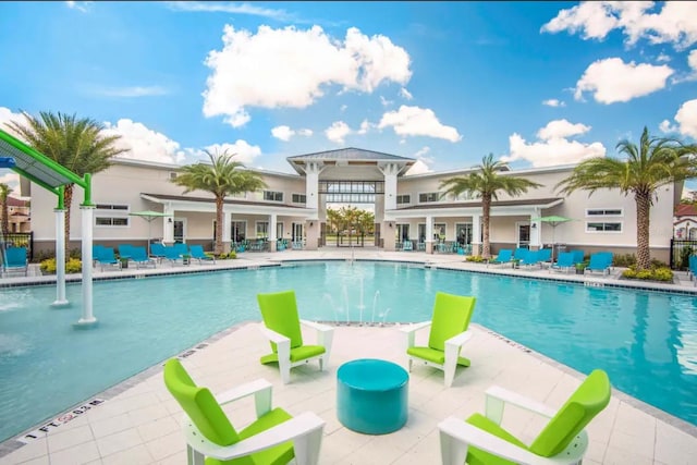 view of swimming pool with a patio area