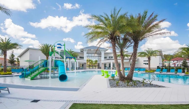 view of jungle gym with a community pool