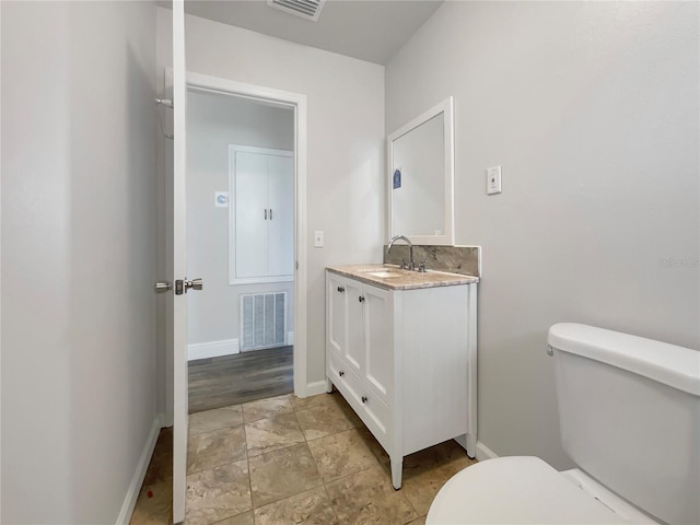 bathroom with vanity and toilet