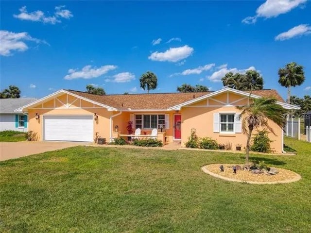 ranch-style house with an attached garage, concrete driveway, a front yard, and stucco siding