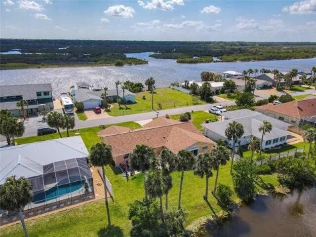 aerial view featuring a residential view and a water view