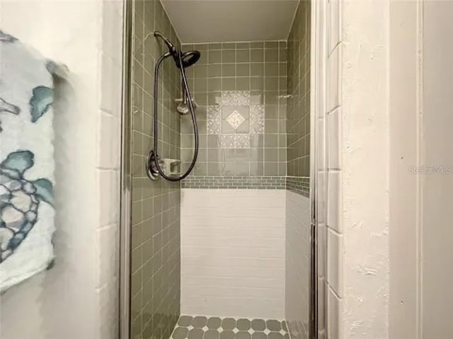 bathroom with a stall shower