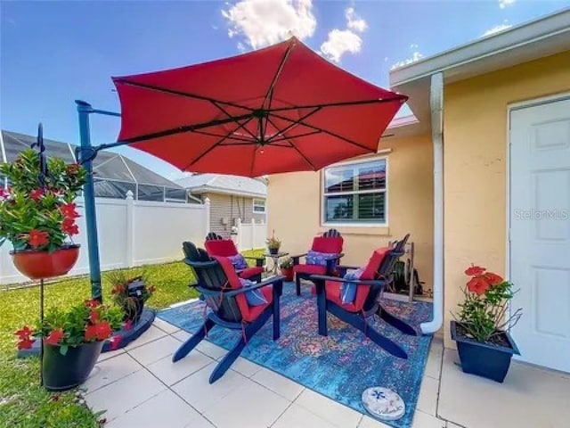 view of patio / terrace featuring fence and an outdoor living space