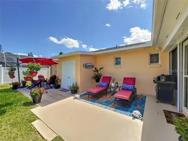 view of patio / terrace featuring fence