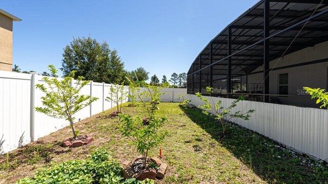 view of yard featuring a lanai