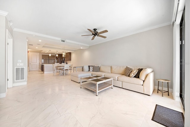 tiled living room with ceiling fan and ornamental molding