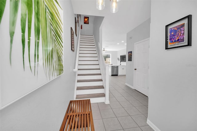 interior space featuring an inviting chandelier and light tile floors