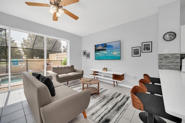 tiled living room featuring ceiling fan