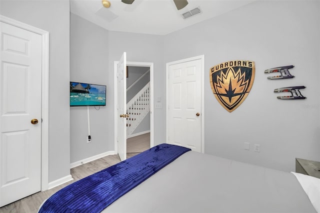 bedroom with ceiling fan and light hardwood / wood-style floors