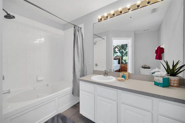 full bathroom with toilet, an inviting chandelier, tile floors, vanity, and shower / tub combo with curtain