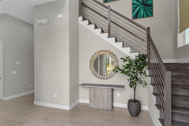 staircase featuring tile floors