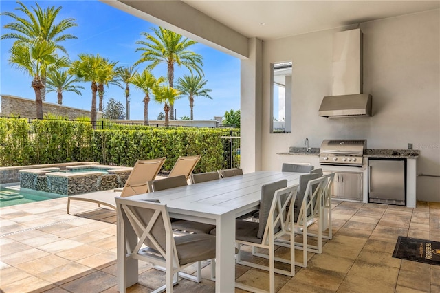 view of patio featuring an in ground hot tub and area for grilling