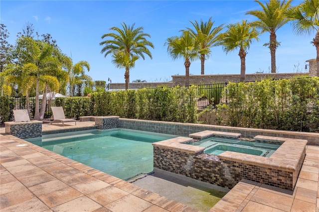 view of pool with an in ground hot tub