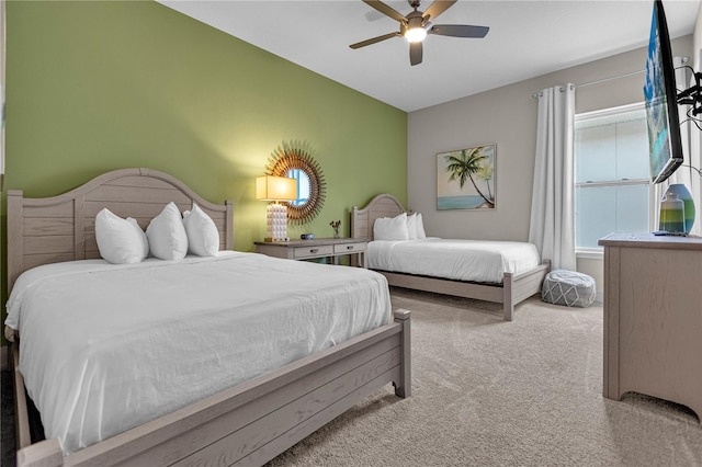 bedroom with ceiling fan and carpet floors