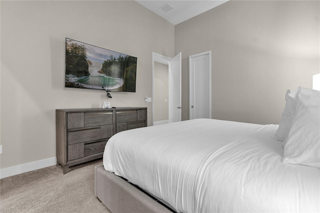 bedroom featuring light colored carpet