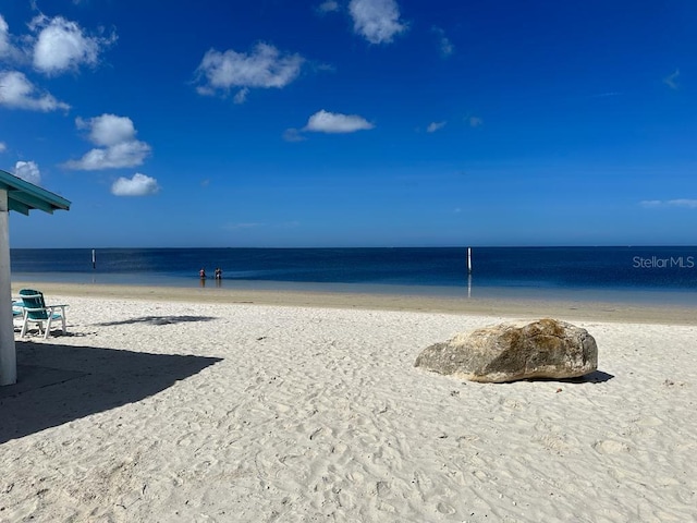 view of water feature with a beach view