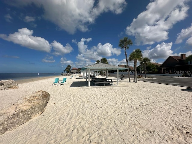 exterior space with a water view and a gazebo