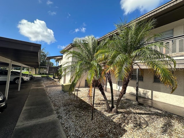 exterior space featuring a carport