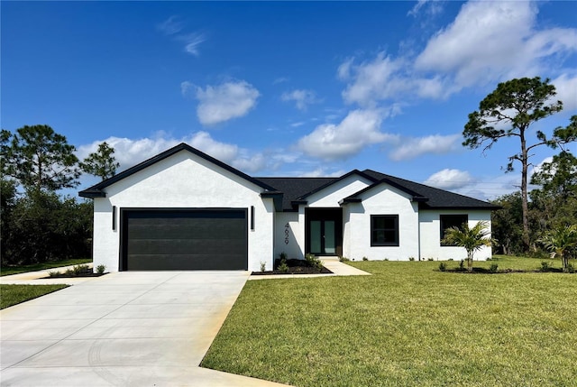 view of front of house with a garage and a front yard