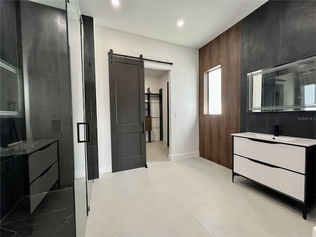 interior space with vanity with extensive cabinet space and tile flooring