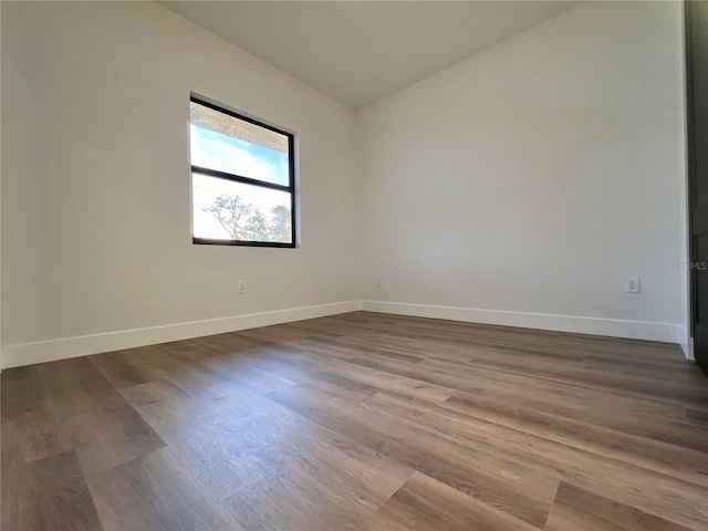 unfurnished room featuring dark hardwood / wood-style floors