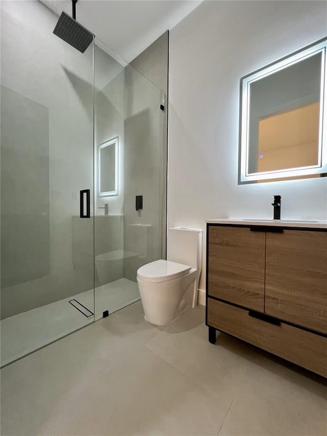 bathroom with walk in shower and vanity