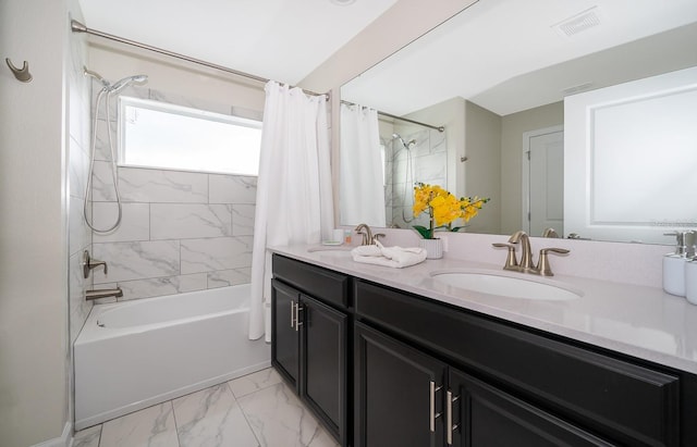 bathroom featuring dual sinks, tile flooring, shower / bath combo, and vanity with extensive cabinet space