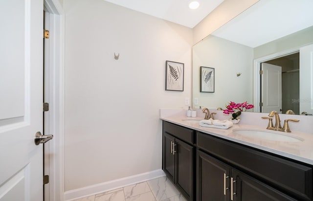 bathroom featuring tile floors and double vanity