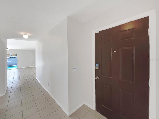 foyer featuring light tile flooring